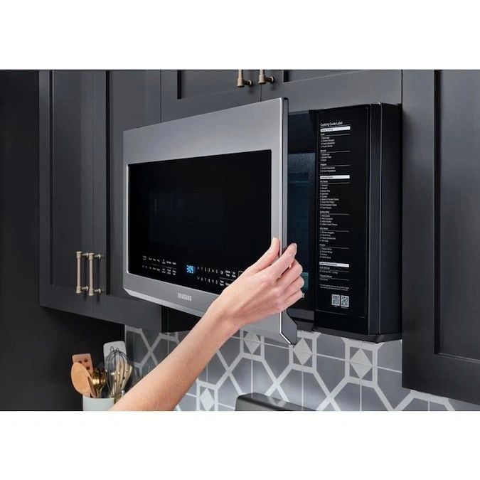 New in Box. Samsung 30 in. W 2.1 cu. ft. Over the Range Microwave in Fingerprint Resistant Stainless Steel with Sensor Cooking. Model: ME21M706BAS