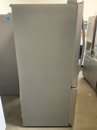 New Open Box. 24 cu. ft. Bottom Freezer Refrigerator in Stainless Steel with Multi-Air Flow and Reversible Door. Model: LDCS24223S